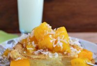 Creamy Coconut Bread Pudding with Mango Sauce