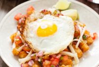 Loaded Totchos Topped with a Runny Fried Egg