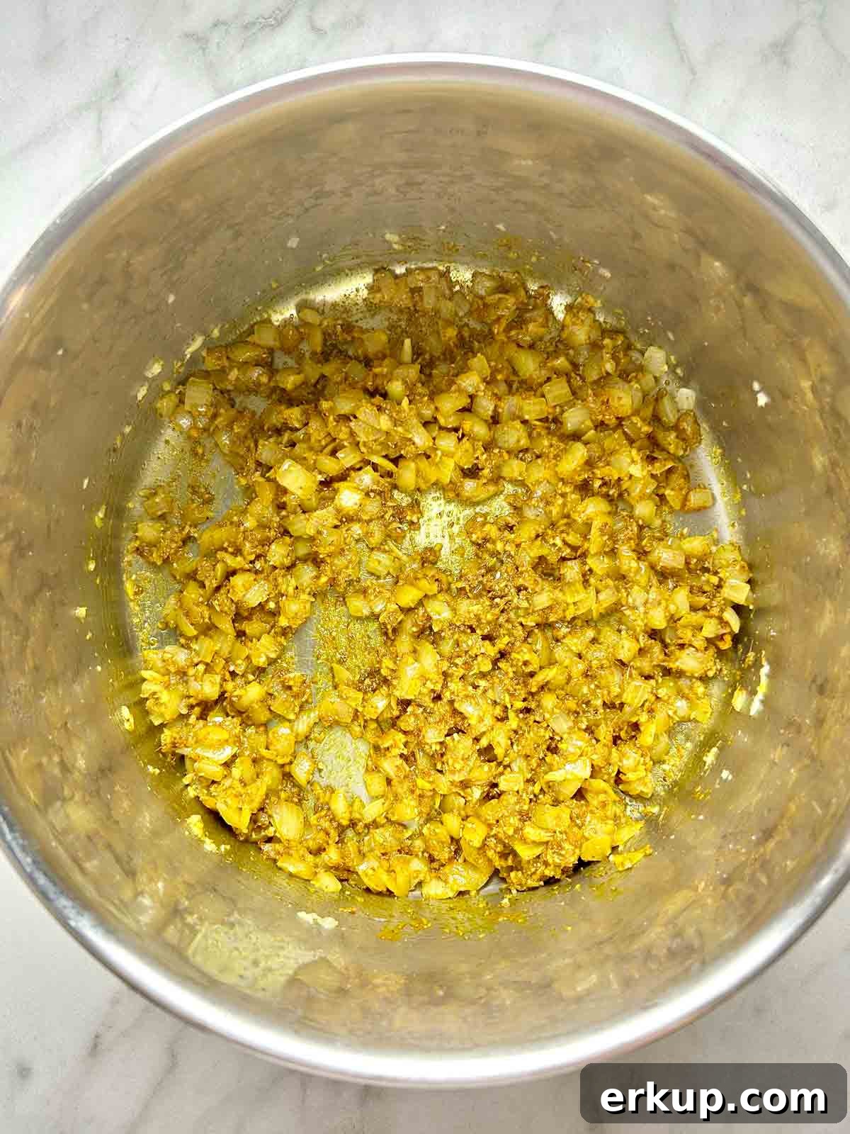 Vegan Mung Bean and Coconut Curry Recipe 5 sautéing aromatics with spices in pot