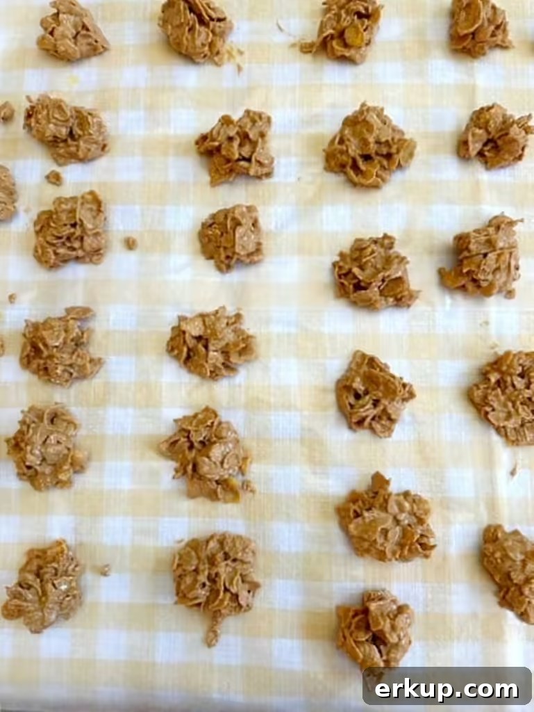 cornflake cookies cooling on wax paper