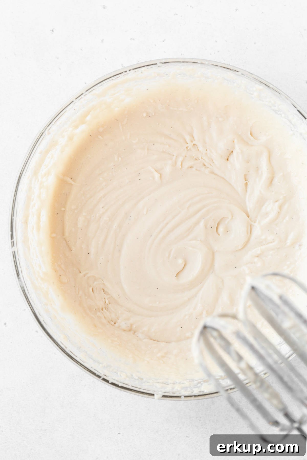 The dairy-free ice cream base in a glass mixing bowl before freezing.