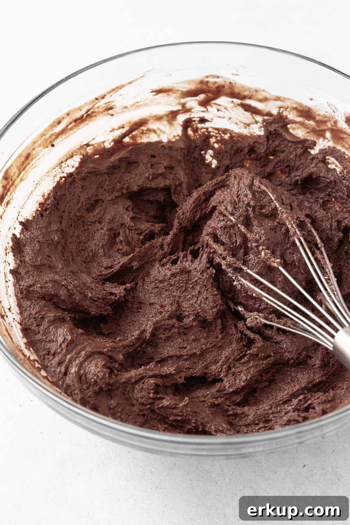 The chocolate sandwich cookie batter in a glass mixing bowl.