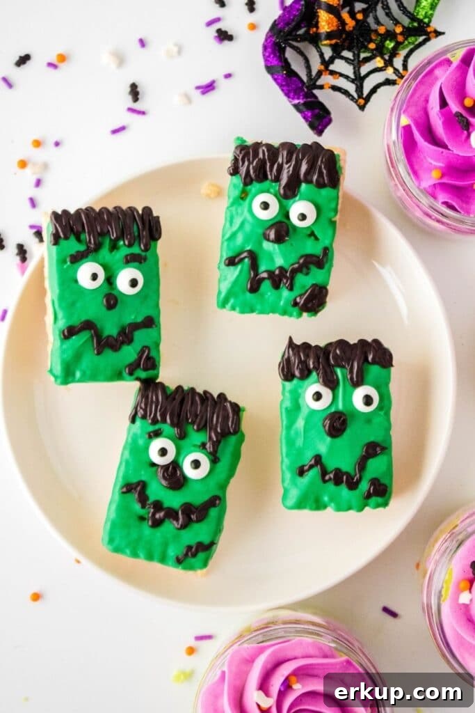 Spooky Frankenstein Rice Krispies Treats for Halloween 6 halloween rice crispy treats on a plate with cupcakes around it
