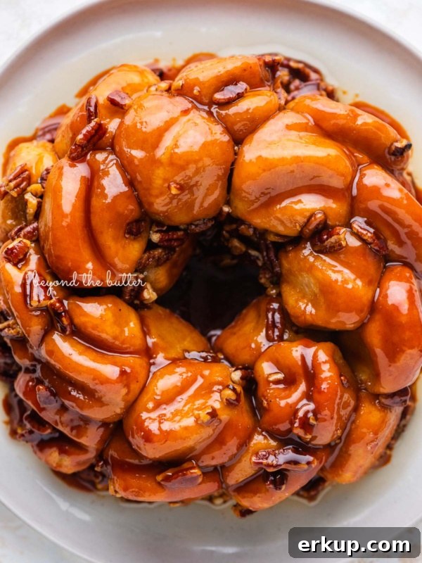 Overhead view of butterscotch bundt rolls on white dessert plate