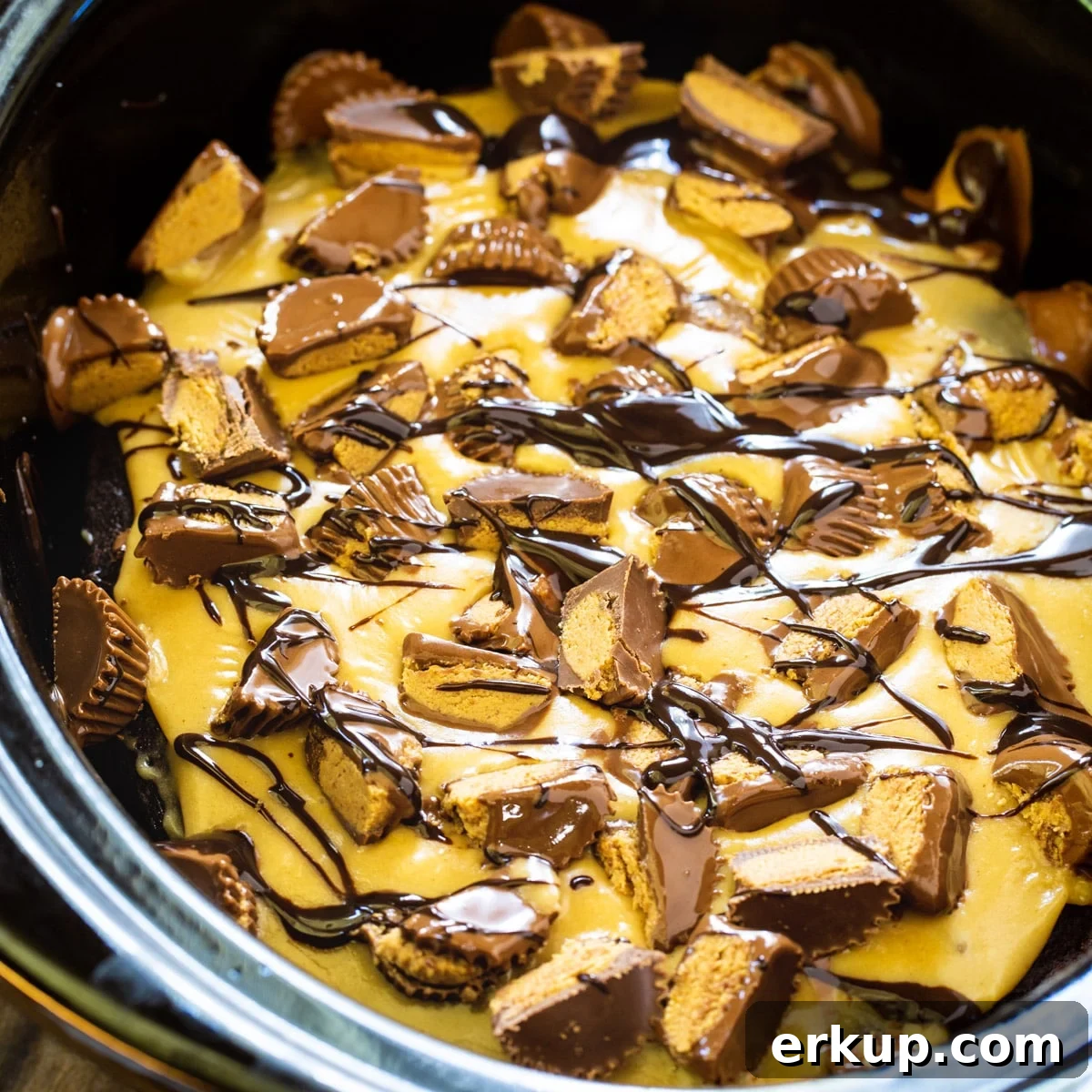 Chocolate Peanut BUtter Cake in a black slow cooker.