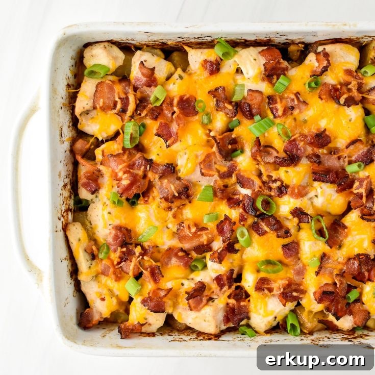 Chicken bacon ranch potato bake fresh from the oven in a rectangular dish.
