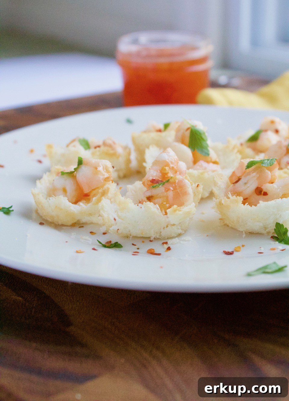 These baked coconut shrimp cups are a fun twist on a classic appetizer. An easy, and gluten-free party recipe that is sure to be a crowd-pleaser! | @sinfulnutrition | AD | #seafoodparty | @seafood4health