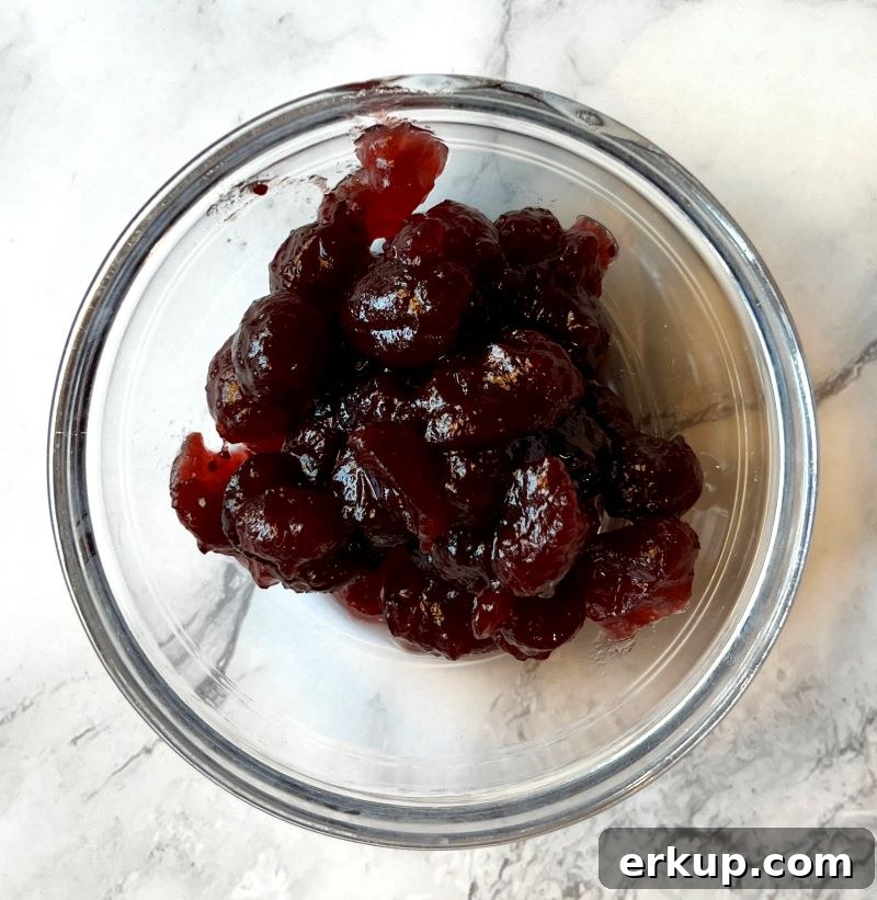 Whole cranberry pieces from a can of whole cranberry sauce.