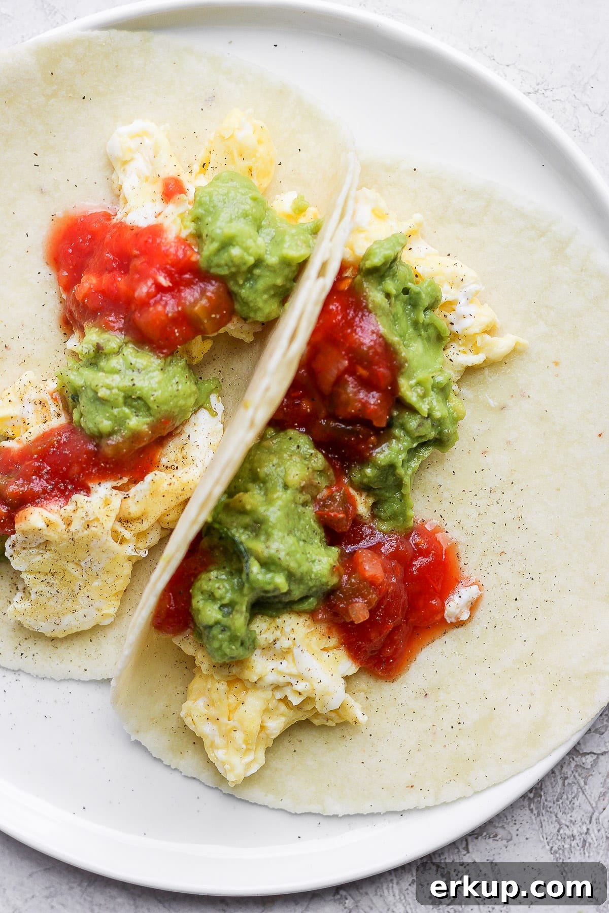 High-Protein Breakfast Tacos with Eggs and Avocado 5 Two open-faced breakfast tacos.