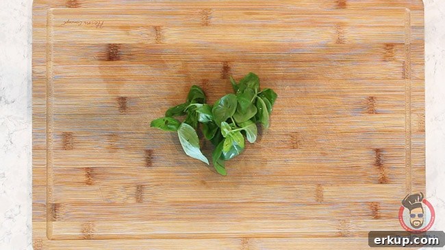 fresh basil on a wood cutting board to make shrimp scampi