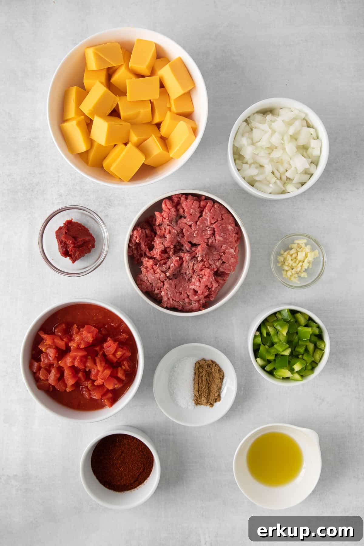 Velveeta chili cheese dip ingredients in bowls.