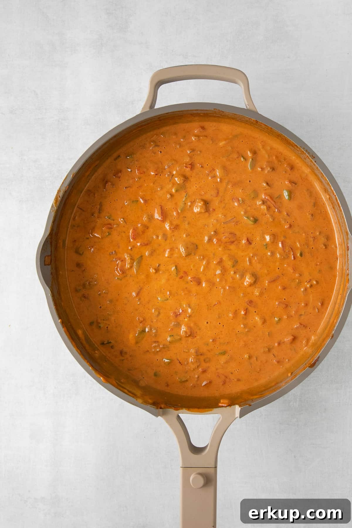 Velveeta chili cheese dip in a skillet.