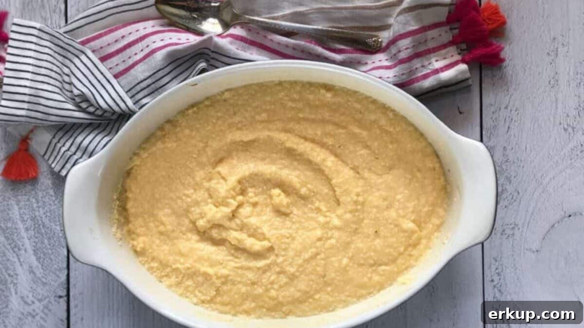 A white oval dish filled with creamy grits
