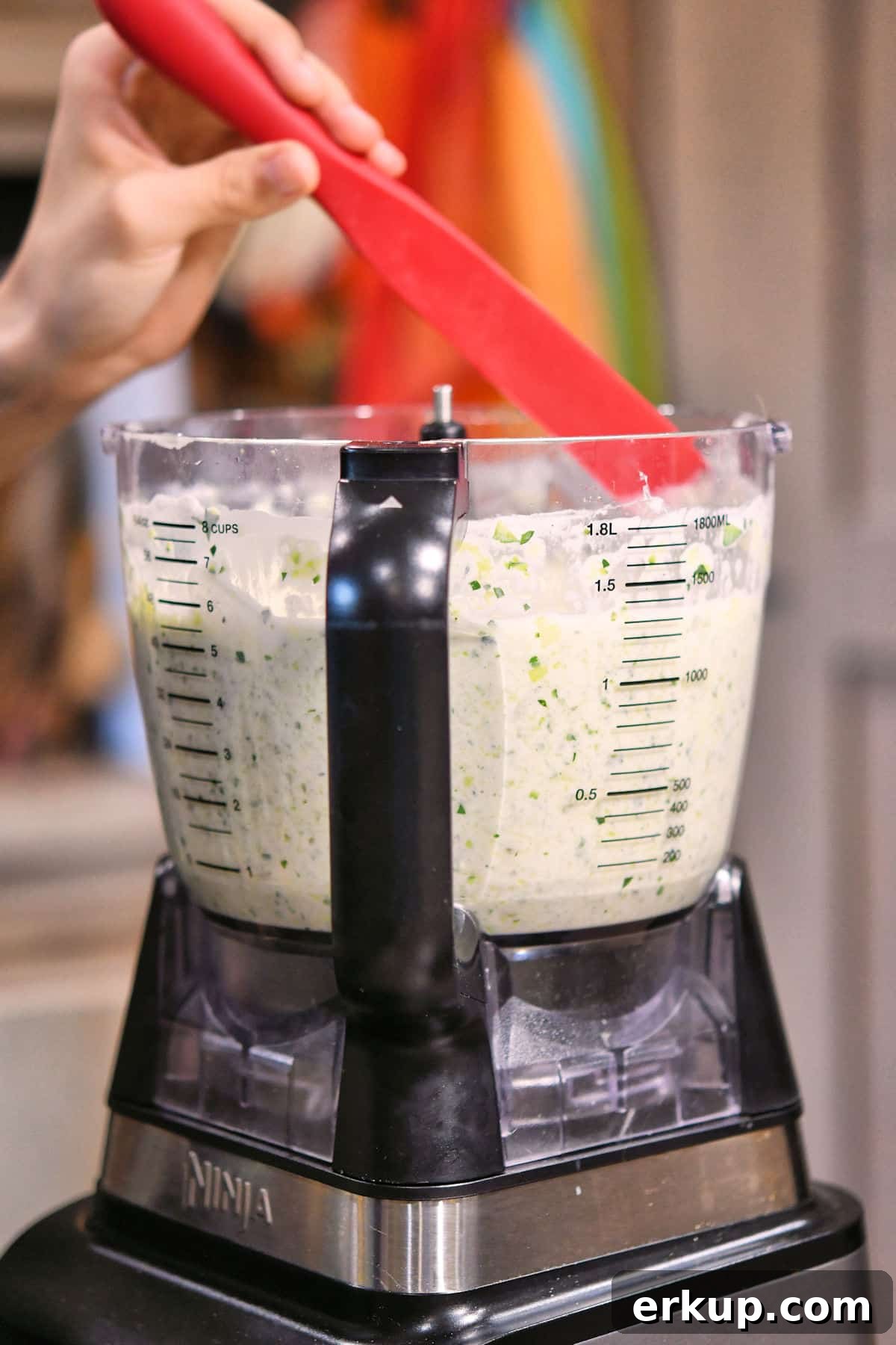Zucchini Pasta Sauce Recipe with Garlic and Basil 7 scraping down the sauce along the sides of the food processor