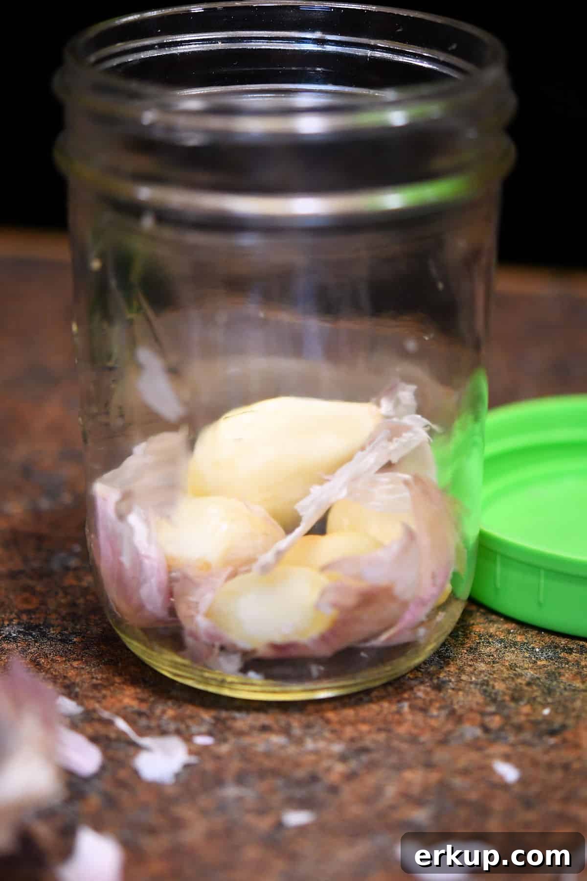 Zucchini Pasta Sauce Recipe with Garlic and Basil 6 garlic cloves in a pint jar with little pieces of the peel remaining