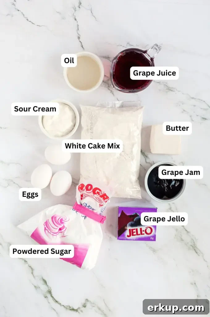 A soft purple grape cake using a cake mix and topped with buttercream swirls and black grapes.