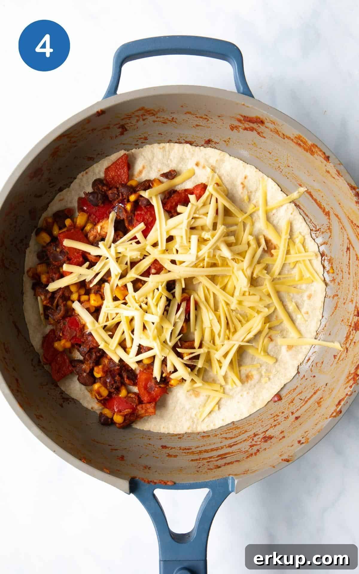 Black Bean Quesadillas Recipe with Creamy Avocado Salsa 7 Sweetcorn, Black Beans, Grated Cheese, Pepper, Mushrooms, spice, garlic, lime, onion, tomato puree in a frying pan.