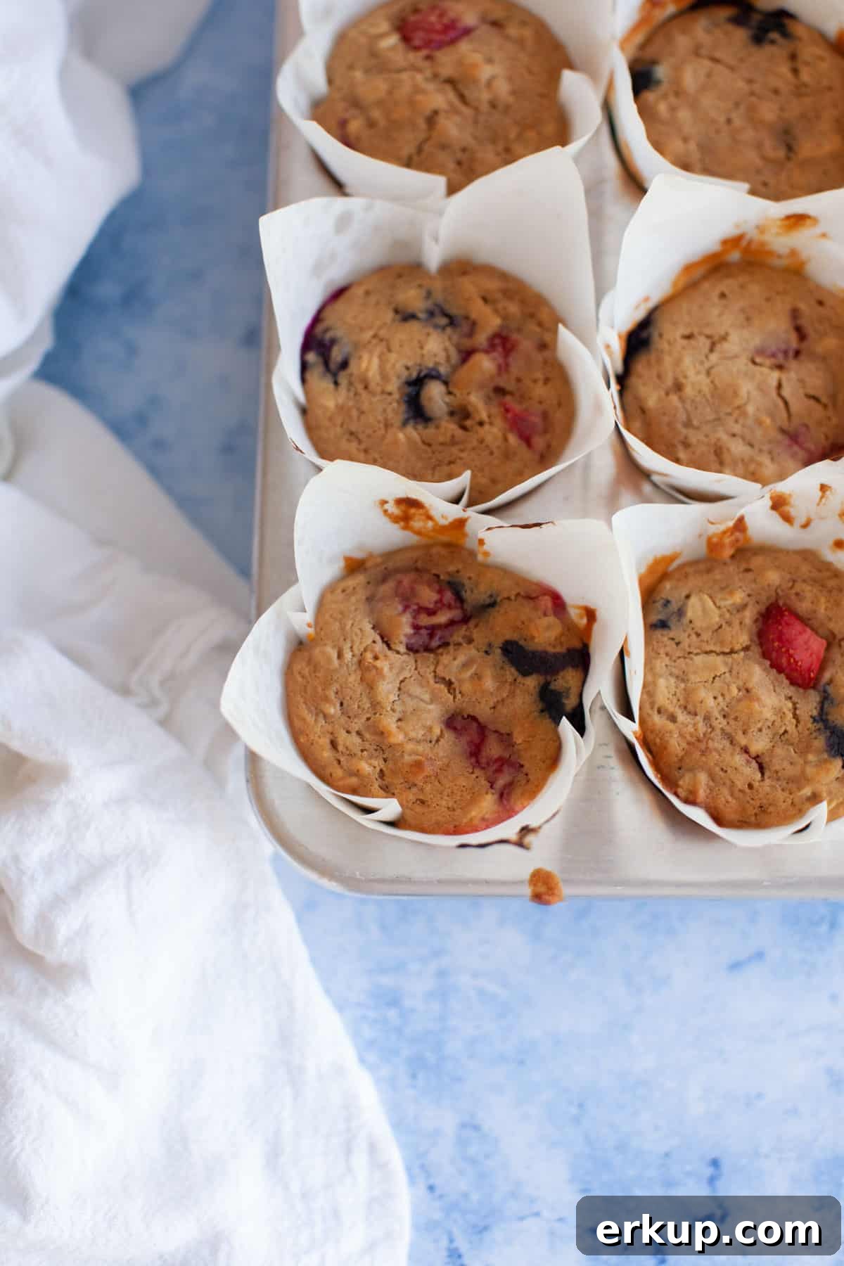 Mixed Berry Muffins Recipe: Moist Blueberry Raspberry Muffins 9 fresh baked berry muffins in a pan.