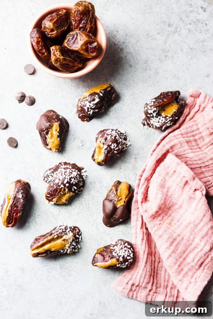 Almond Butter Stuffed Dates Recipe 4 Dates with seeds and pitted ones covered in chocolate and coconut flakes