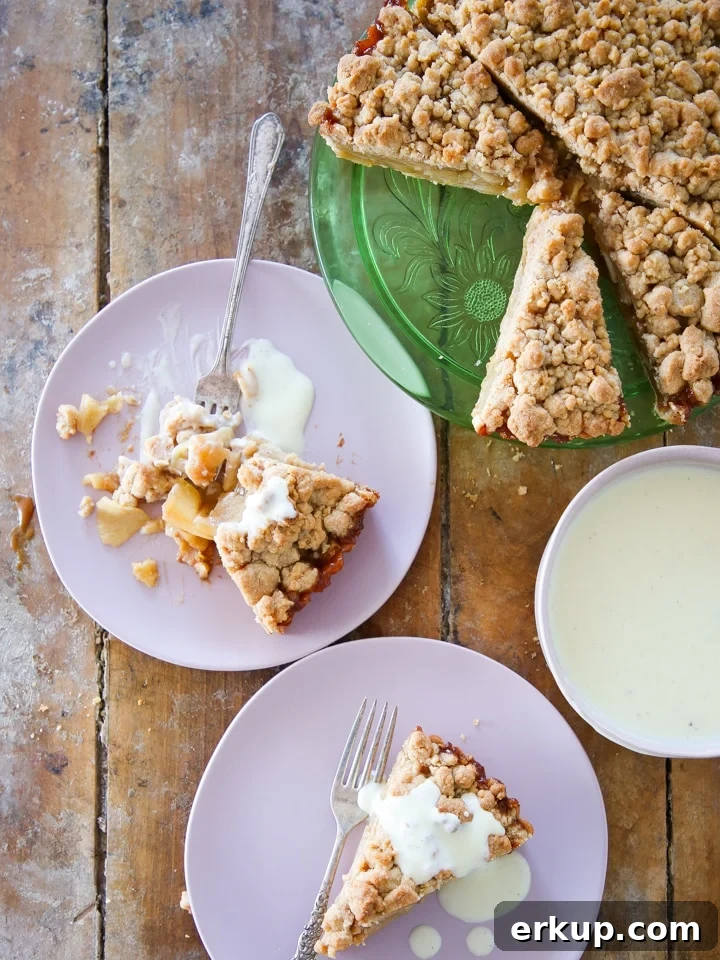 Caramel Apple Tart Recipe with Flaky Buttery Crust 4 Caramel Apple Tart sliced on wood surface