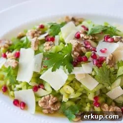 Celery Salad On White Platter with Pomegranate and Cheese