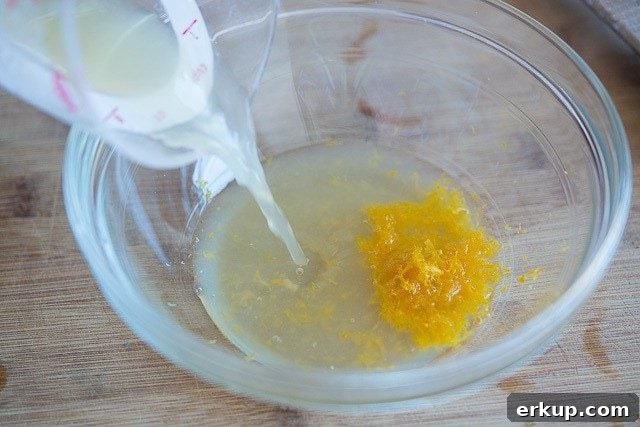 Lemon Juice Pouring in With Zest