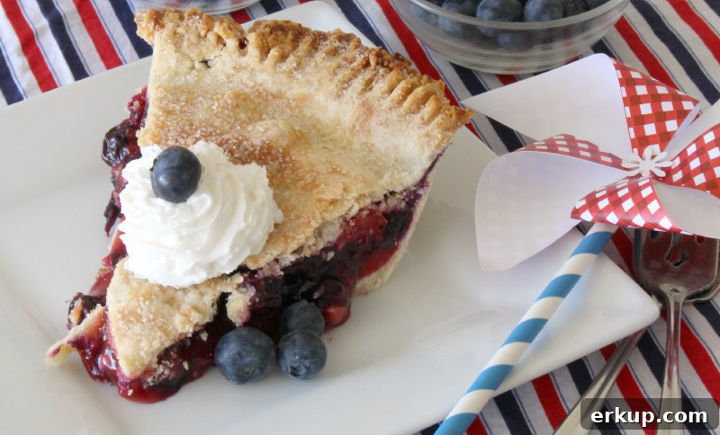Slice of cherry blueberry pie