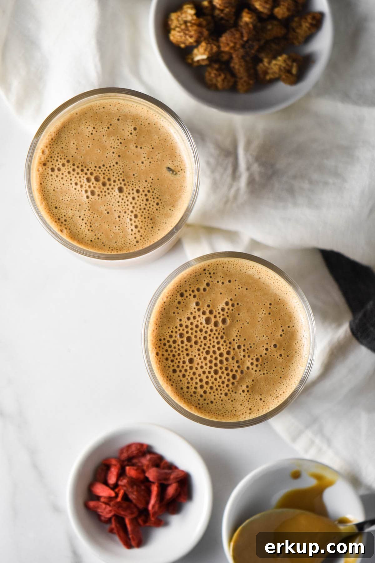 Creamy Sunflower Seed Butter and Maca Smoothie Recipe 5 Two smoothies next to goji berries