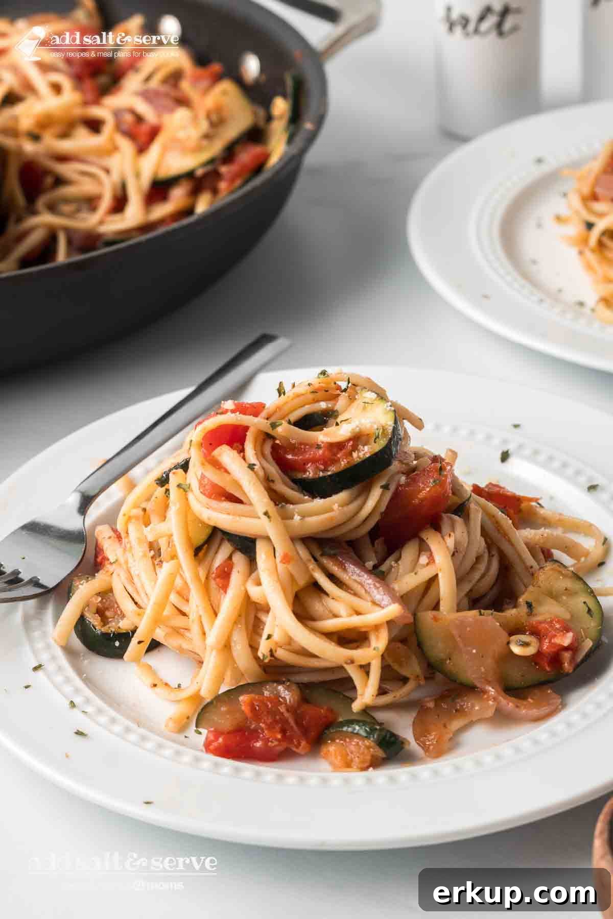 Lemon Garlic Zucchini Linguine with Parmesan 2 Stovetop zucchini linguine on a plate.
