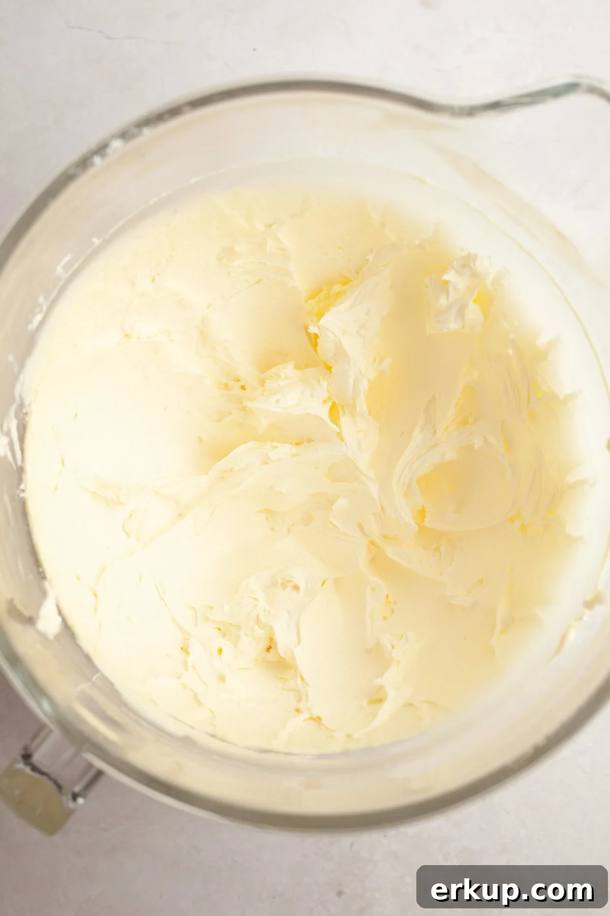 Vanilla bean buttercream in a large glass bowl.