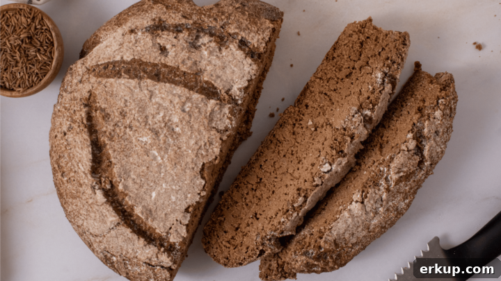 Gluten-Free Rye Bread sliced with a bread knife.