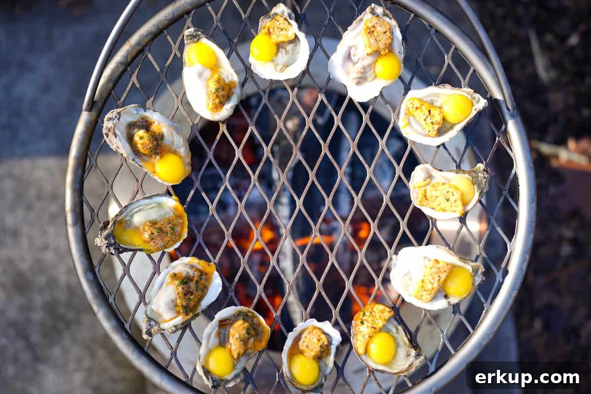 The oysters with butter and quail eggs cooking on the grill.