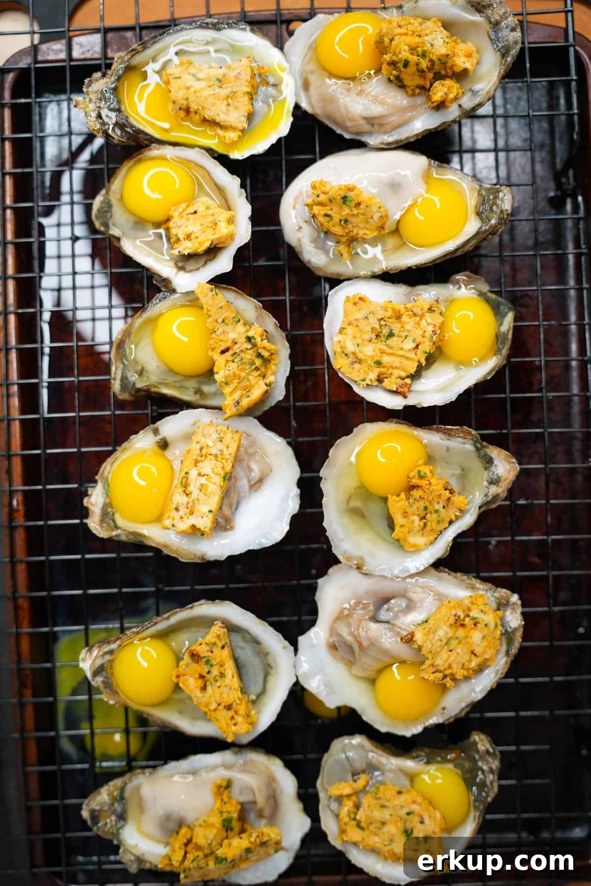 The oysters topped with compound butter and quail eggs.