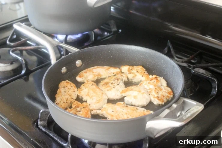 cooking chicken breast tenders in a pan