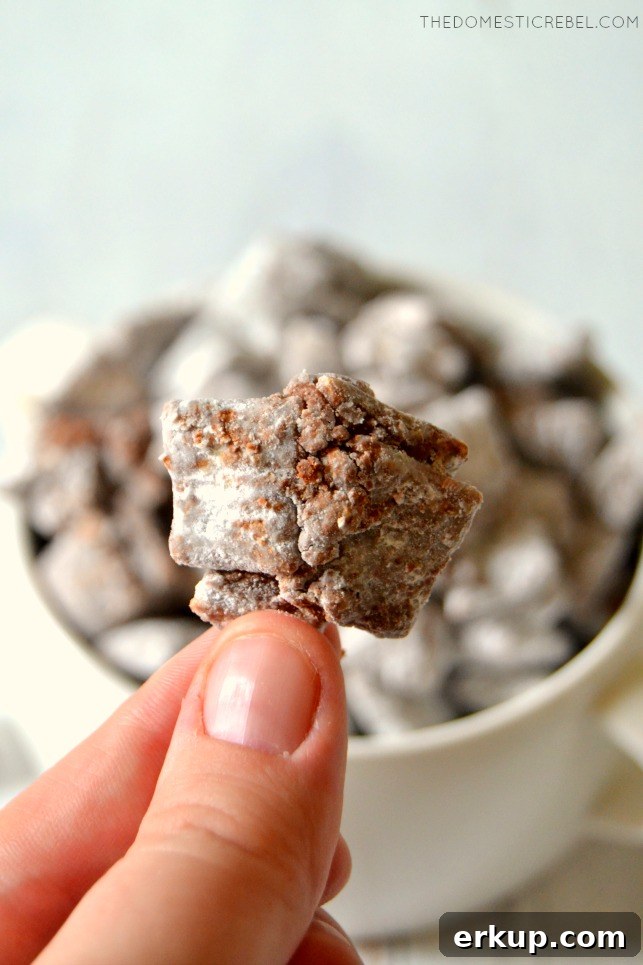 Author holding a cluster of muddy buddies