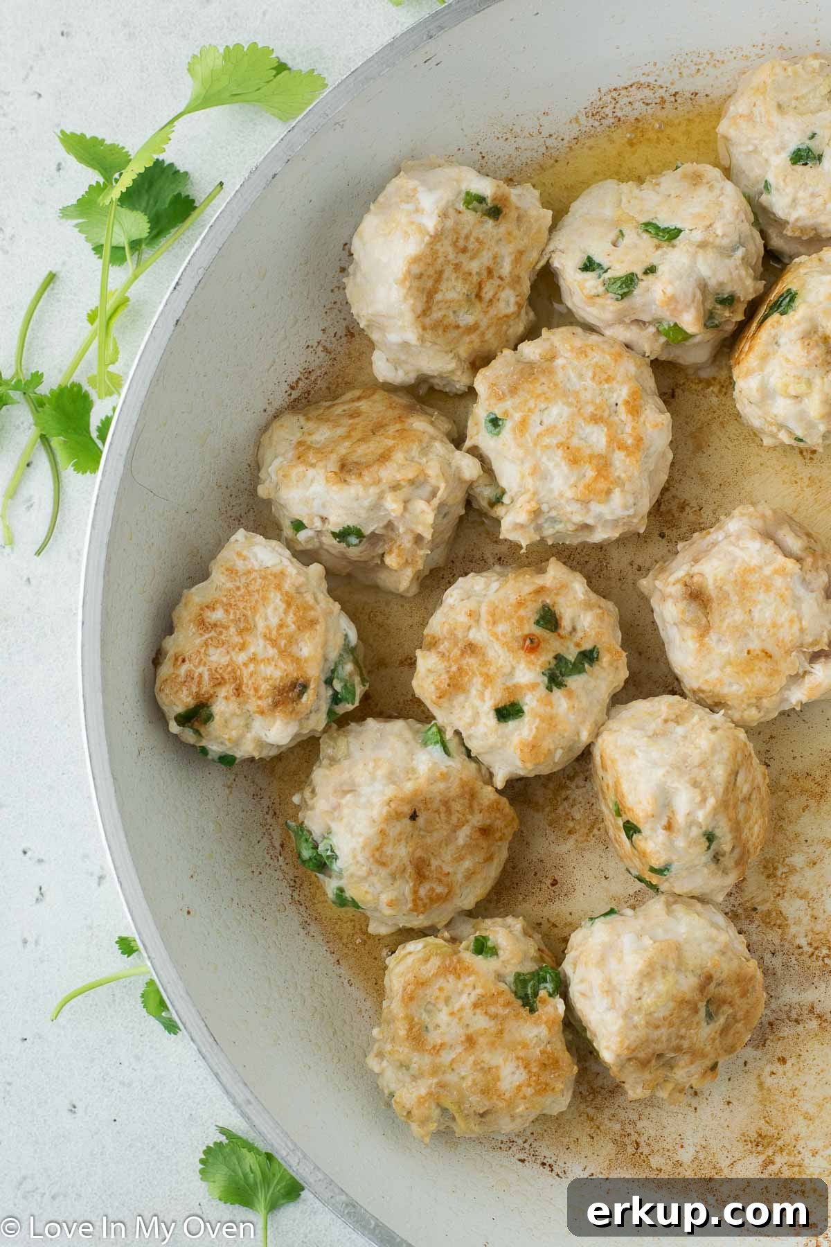 thai chicken meatballs in pan