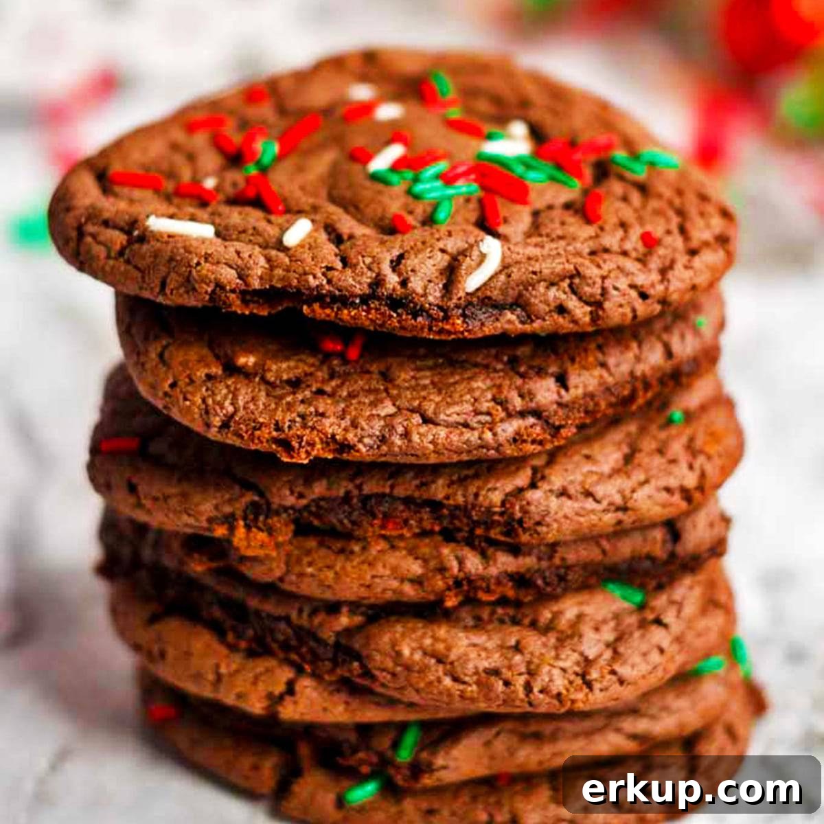 a stack of Chocolate Christmas cookies A stack of chocolate cookies with sprinkles on top.