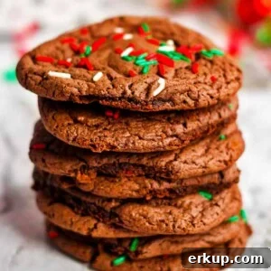 20-Minute Cake Mix Cookies Recipe 4 A stack of chocolate cookies with sprinkles on top.