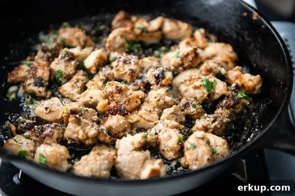 Finished garlic parmesan chicken bites in pan