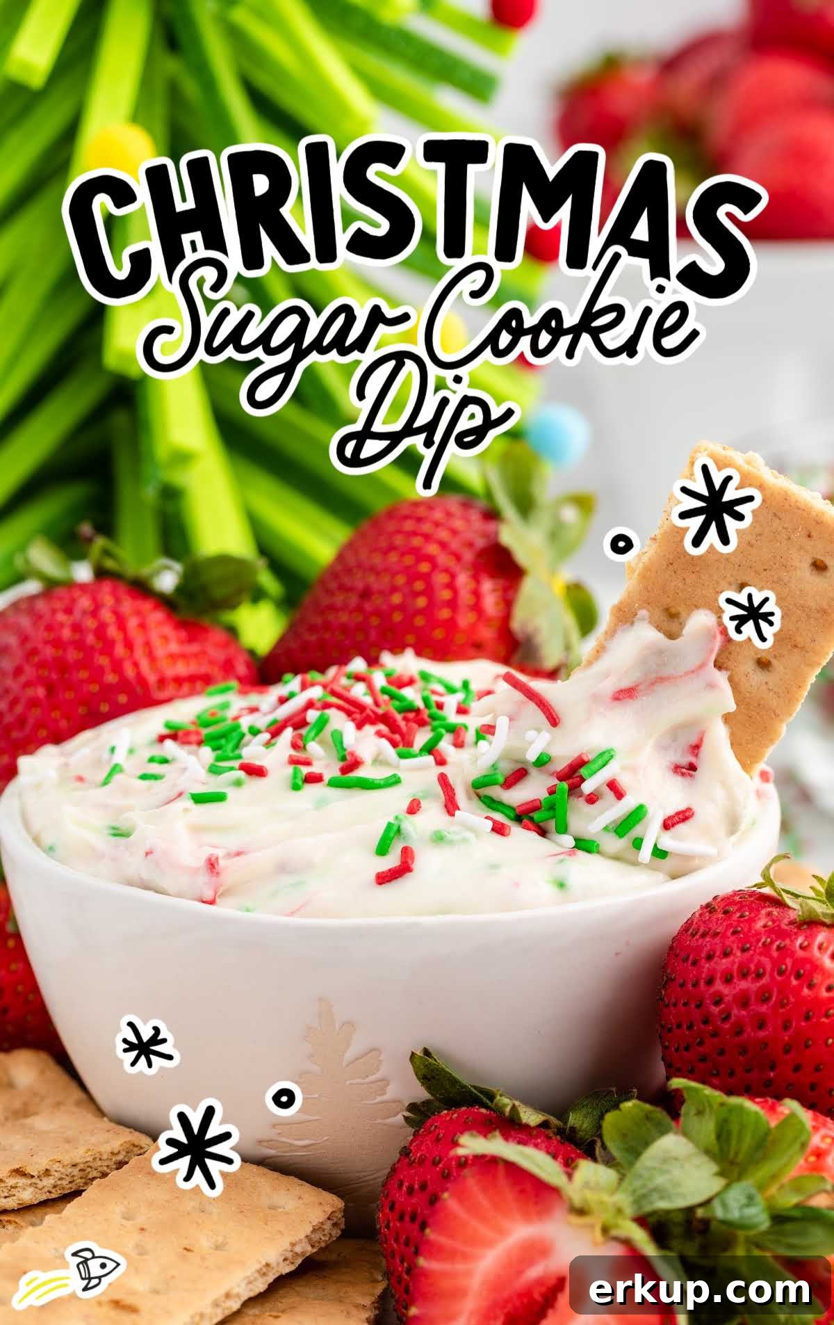 Creamy Christmas Sugar Cookie Dip Recipe for Holiday Parties 2 a close up shot of Christmas Sugar Cookie Dip in a bowl topped with a graham cracker