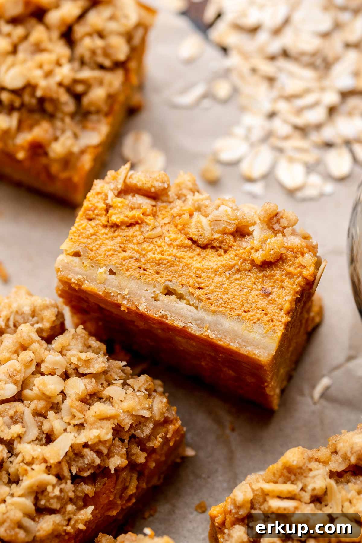 Pumpkin Pie Bars with Buttery Shortbread Crust 2 A square of pumpkin pie bars laying on its side.