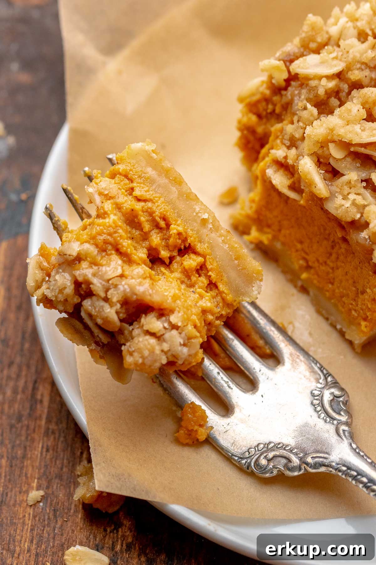 Pumpkin Pie Bars with Buttery Shortbread Crust 12 A piece of pumpkin pie bar on a fork.