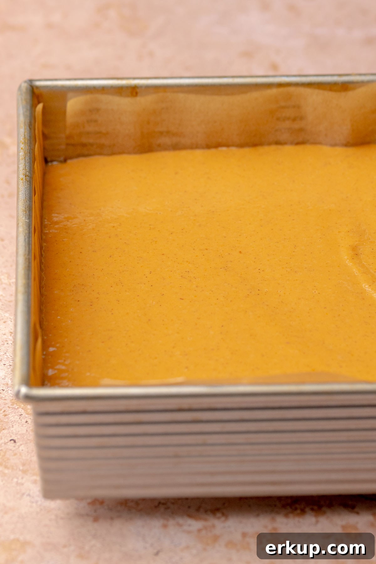 Pumpkin Pie Bars with Buttery Shortbread Crust 8 Pumpkin pie filling in a square pan.