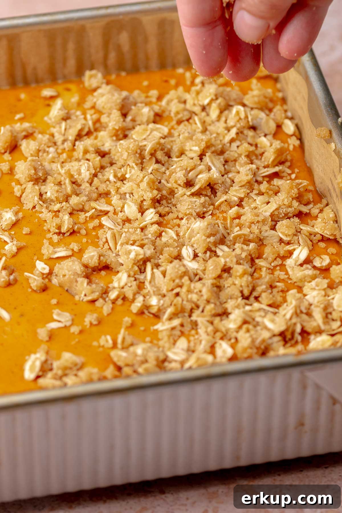 Pumpkin Pie Bars with Buttery Shortbread Crust 10 Crumble topping on par-baked pumpkin pie bars.