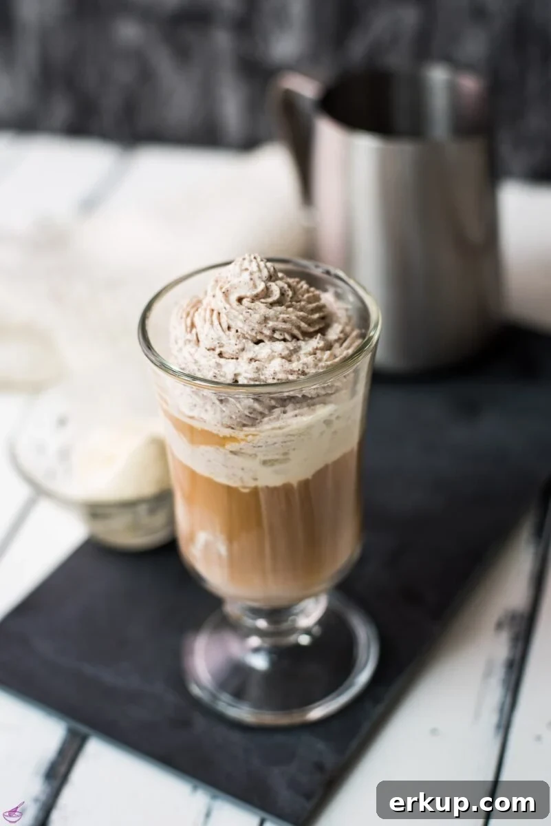 Beautiful glass filled with delicious vanilla iced coffee. Topped with chocolate-flavored whipped cream.