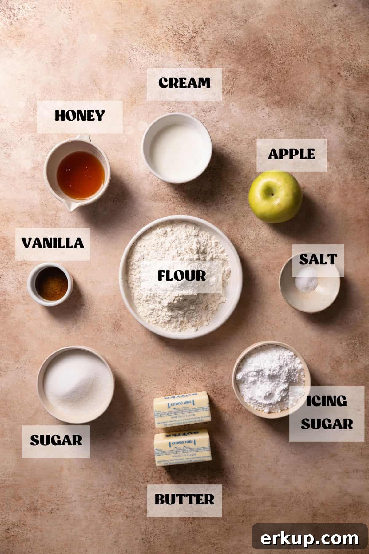 Ingredients needed to make apple caramel bars in bowls with labels.