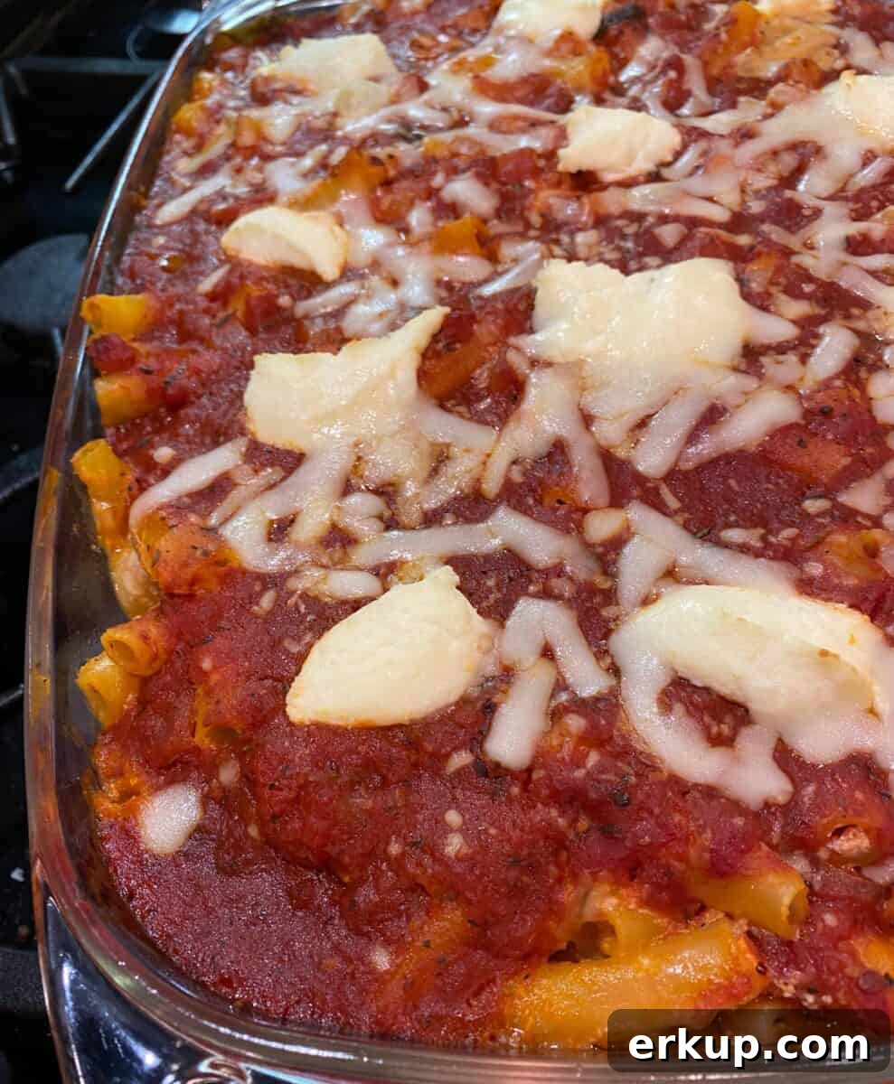 Creamy Cheesy Baked Ziti Casserole Recipe 2 Large pan of ziti pasta with red sauce and cheese on top.