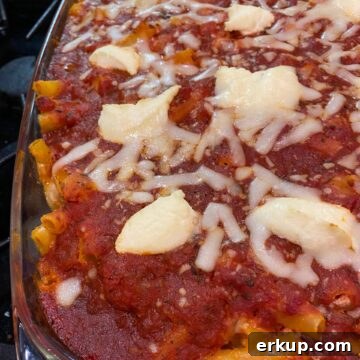 Creamy Cheesy Baked Ziti Casserole Recipe 9 Large pan of ziti pasta with red sauce and cheese on top.