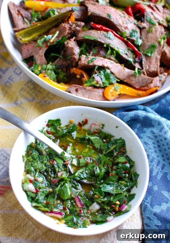 Easy Grilled Flank Steak with Chimichurri Sauce up close on the sauce