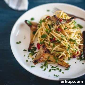 spaghetti served with artichokes on a plate